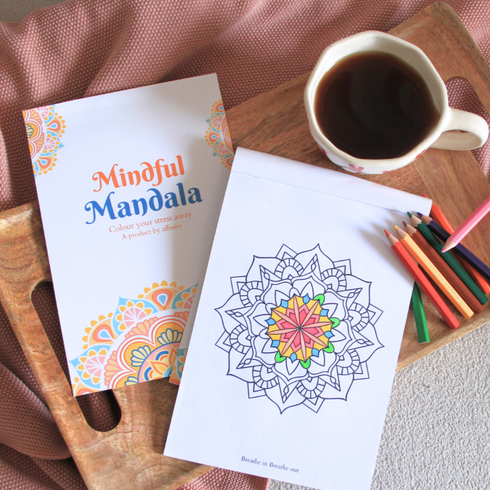 Coloring book with mandala design, coffee cup, and coloring pencils on a wooden tray. affinity mindful mandala aesthetic photo