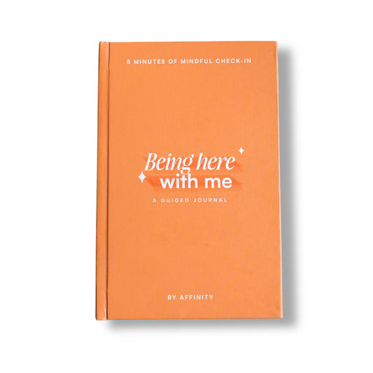 Orange self care journal titled 'Being here with me' by Affinity on a white background